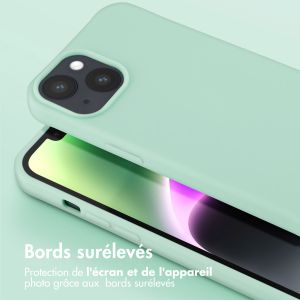 Selencia Coque silicone avec cordon amovible iPhone 14 - Turquoise