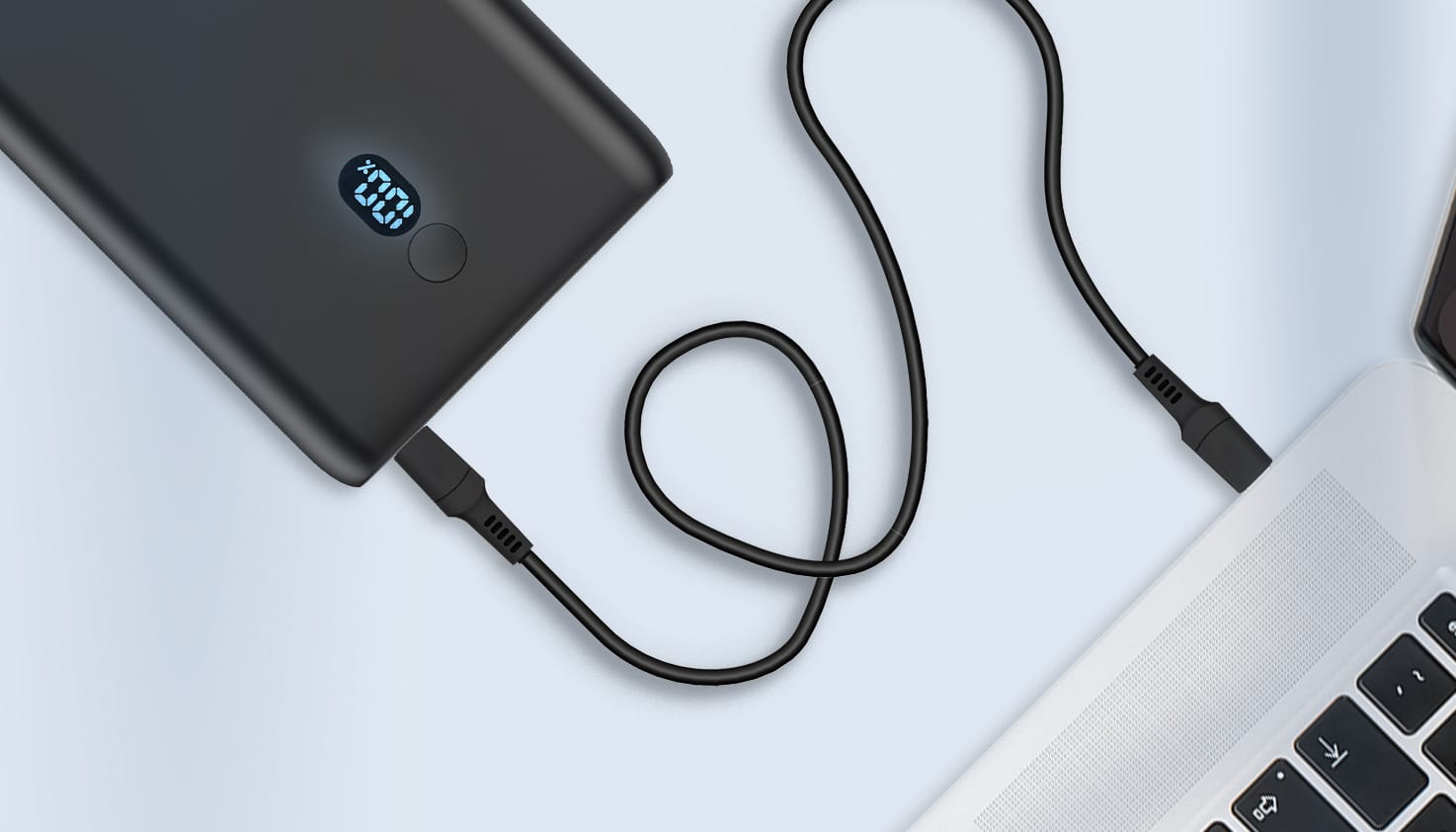 Une batterie externe imoshion connectée à un MacBook.